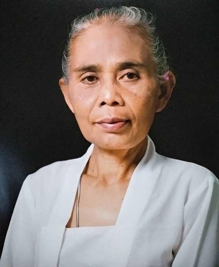 <p><strong>Mangku Muriati</strong>&nbsp;(b. Kamasan, Bali, Indonesia) is a Balinese priestess from the ancient village of Kamasan, known for its painting tradition. In addition to traditional training from her father, the legendary painter Mangku Mura (1920-1999), she received academic training in art at the Udayana University, Bali. Mangku Muriati is participating in Sharjah Biennale 2025 in UAE with her paintings this year. Muriati paints in traditional Balinese form, known as Kamasan-style, where aesthetic form and narration relate to the Wayang Kulit puppet theatre. This form of painting is associated with the East Javanese kingdom of Majapahit, which flourished in the 14th and 15th centuries and helped propagating Hindu faith across the region &ndash; now largely retained in Bali. It was Kamasan village, where artists were traditionally recruited to produce classical-style paintings on cloth or bark&nbsp;for religious and ceremonial use and to decorate the palaces and temples. Mangku Muriati&rsquo;s father, Mangku Mura,&nbsp;is considered one of the prominent artists of his generation in Kamasan-style painting. As is common practice in artist families, Muriati used to help her father in colouring paintings from an early age, learning the craft of painting. She studied art at the Udayana University in Denpasar, Bali, and after graduating, returned to the traditional style of painting. In the 1990s, at the age of 32, Muriati was ordained priestess at her local temple in the ward of Banjar Siku. She considers painting and priestly duties as complementary, comparing the role of an artist to a dalang or puppet master, who needs extensive knowledge of characters and stories, ultimately derived from what is considered the sacred scripture: the Hindu epics Ramayana and Mahabharata. The subjects of her paintings and related commentaries frequently refer to social and political issues in contemporary Bali, such as recently the Covid-19 pandemic or portraits of colleagues and herself. In 2023 in collaboration with HFA&nbsp;and Biasa Art, V-Room presented Mangku Muriati&rsquo;s solo exhibition&nbsp;<em>Year of the Tiger&nbsp;</em>in Ubud, Bali.&nbsp;Muriati&rsquo;s paintings have been exhibited and collected in Bali as well as internationally.</p>
