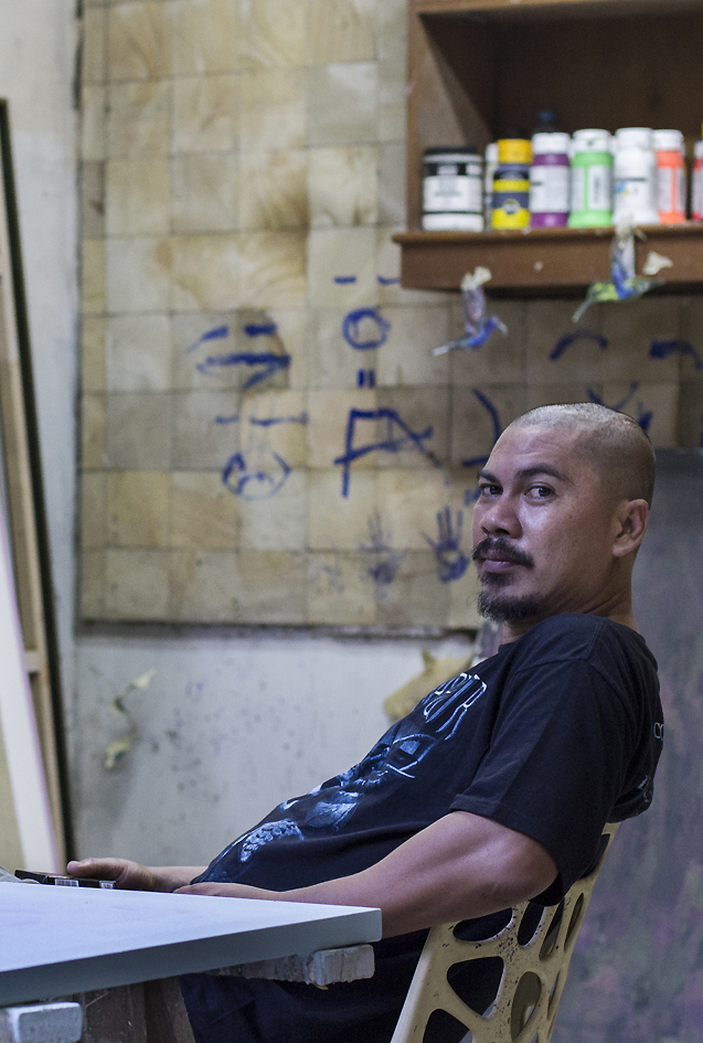 <p style="text-align: justify;"><strong>Jumaldi Alfi</strong> (b. Lintau, Sumatra, Indonesia) has consistently been exploring new possibilities in painting. Over the past ten years his paintings have shown shifting themes and styles. He is particularly known for his compelling personal iconography of visual signs, reflecting existential and spiritual experience on both, an individual and collective level. In creating his comprehensive painting series such as <em>Blackboard Paintings</em> or, more recently, the series of <em>Melting Memories, Collage Paintings</em>, Alfi draws on a scope of references from text to empirical objects of the natural world to Renaissance paintings and his own memories; the effect of his work being at once mysterious and intimate. Jumaldi Alfi lives and works in Yogyakarta, Indonesia and has exhibited extensively in Asia as well as internationally. Recent important exhibitions include <em>Re-reading Landscape, Mooi Indies</em>, ARNDT Singapore, 2014 and <em>Do not Shoot the Painter</em>, UBS Collection exhibition, Galleria d'Arte Moderna, Milan, Italy, 2015. Alfi is a member of the artists&amp;rsquo; group Jendela and a co-founder of the artists&amp;rsquo; initiative and cultural platform OFCA International (Office For Contemporary Art). As co-founder of several artists collectives he developed SaRanG, a location which provides a physical infrastructure of several buildings hosting different art institutions in Yogyakarta, Indonesia.</p>
<p style="text-align: justify;">photographed by Benny Kurniadi</p>